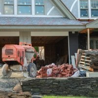 red-tractor-is-outside-house-that-has-been-shoveled-out-wood_871349-7120